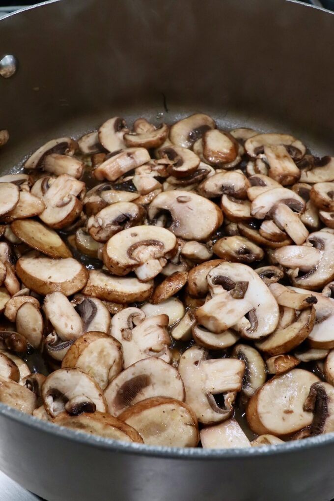 sliced mushrooms in a large pot