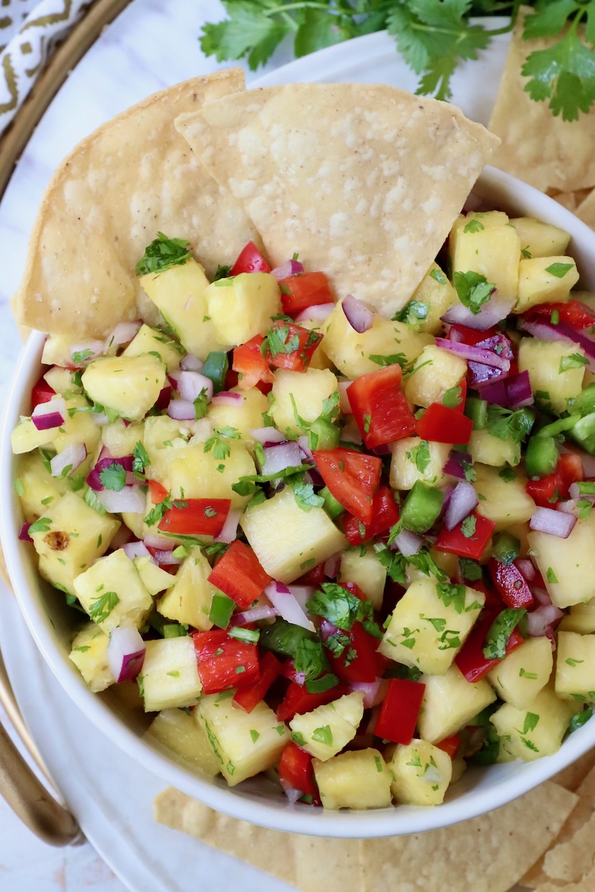 pineapple salsa in bowl with tortilla chips