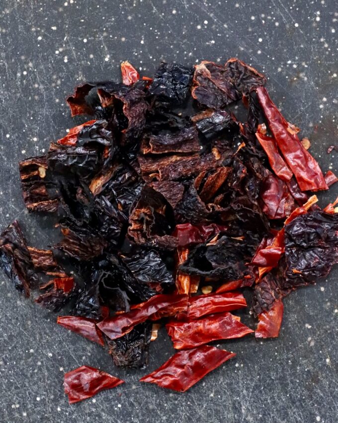 chopped dried chilies on a cutting board