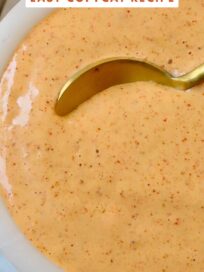 creamy sauce in a bowl with a spoon