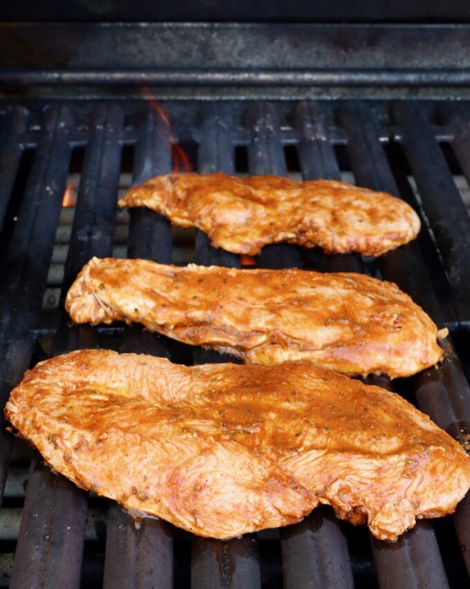 marinated chicken breasts on grill