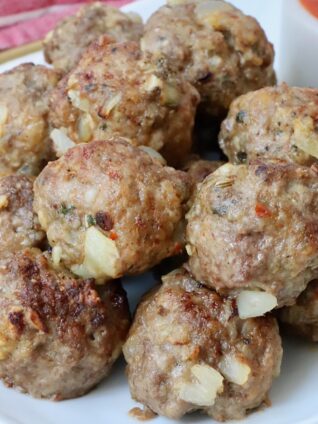 air fried meatballs stacked up on a plate