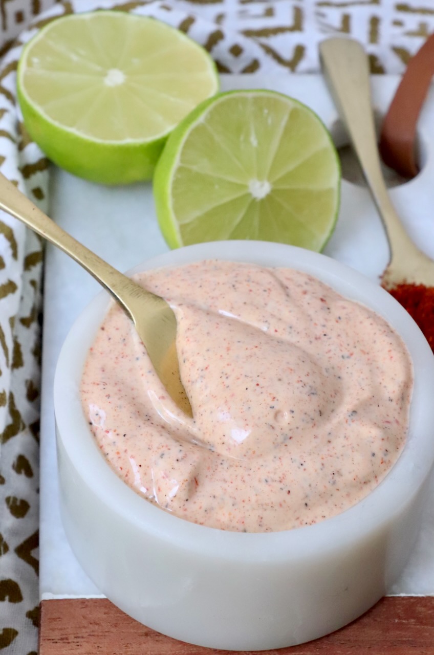 chili lime dressing in bowl with small spoon