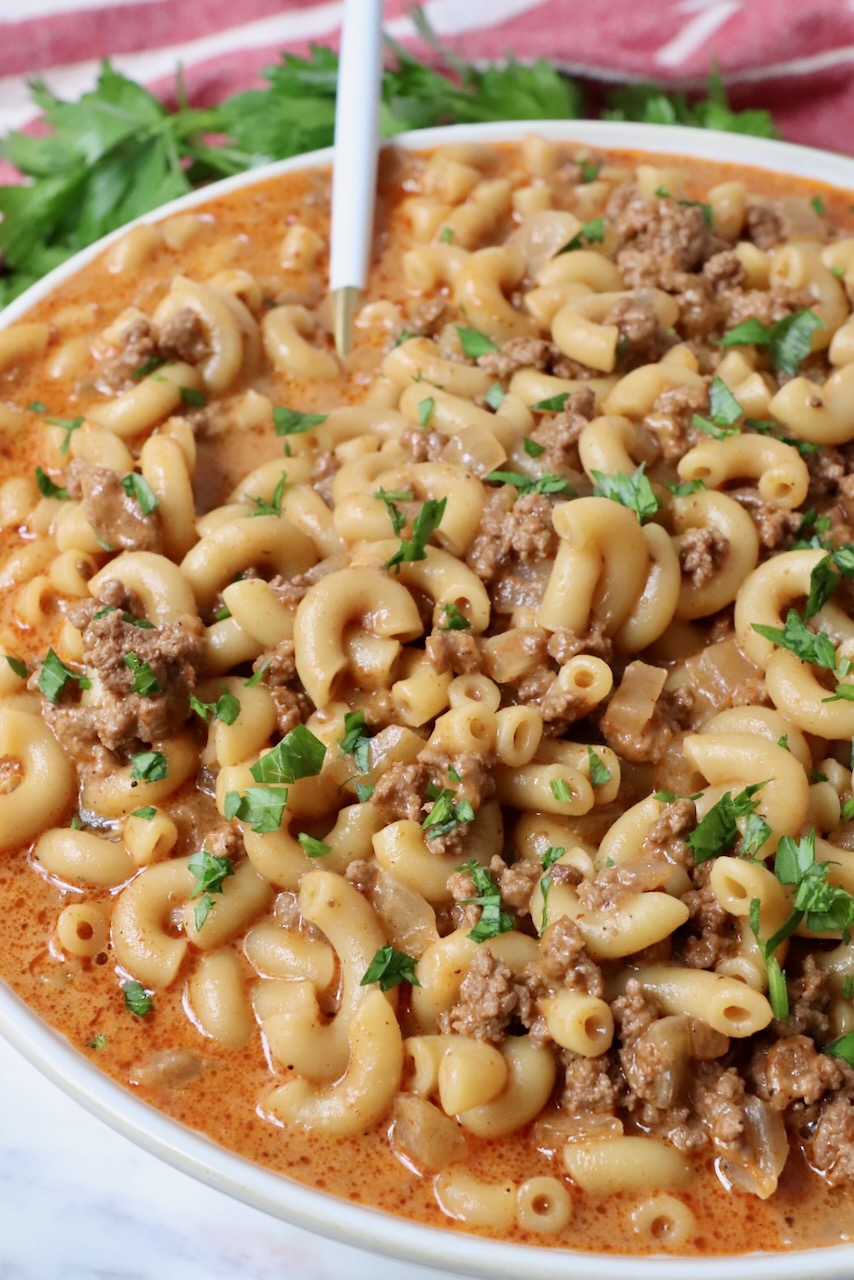 prepared hamburger helper in bowl with spoon