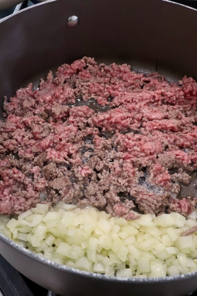 diced onions and ground beef in a large pot