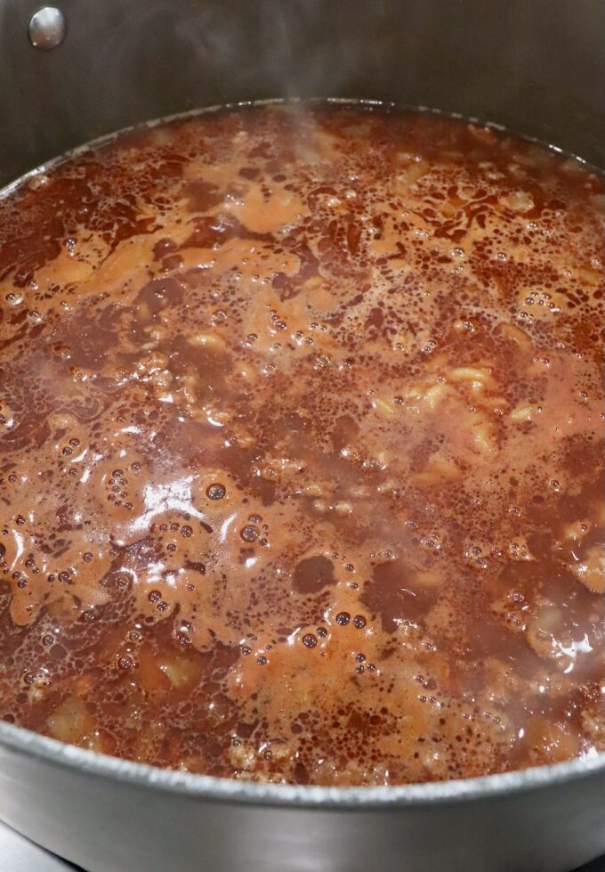 bubbling beef broth in a large pot