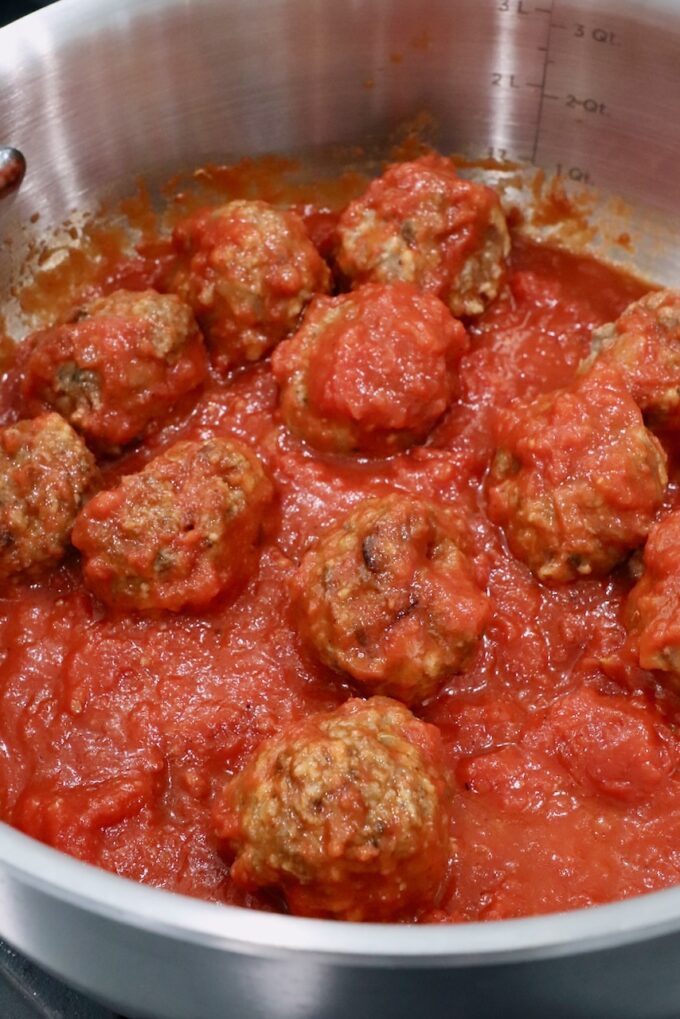 meatballs in marinara sauce in pan on the stove