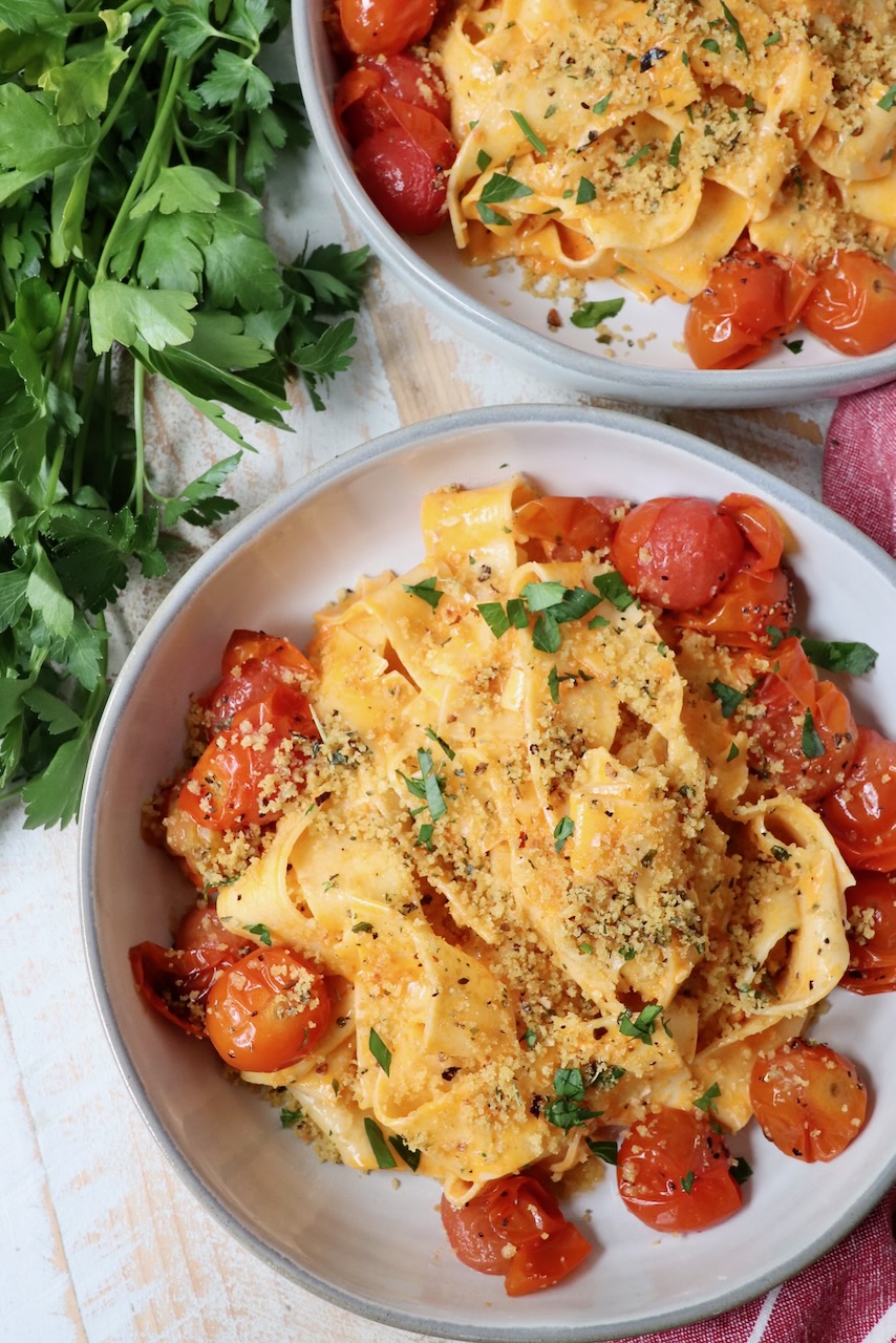 nduja pasta in bowl with roasted cherry tomatoes and toasted breadcrumbs