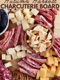 fall charcuterie board with meats cheeses and crackers