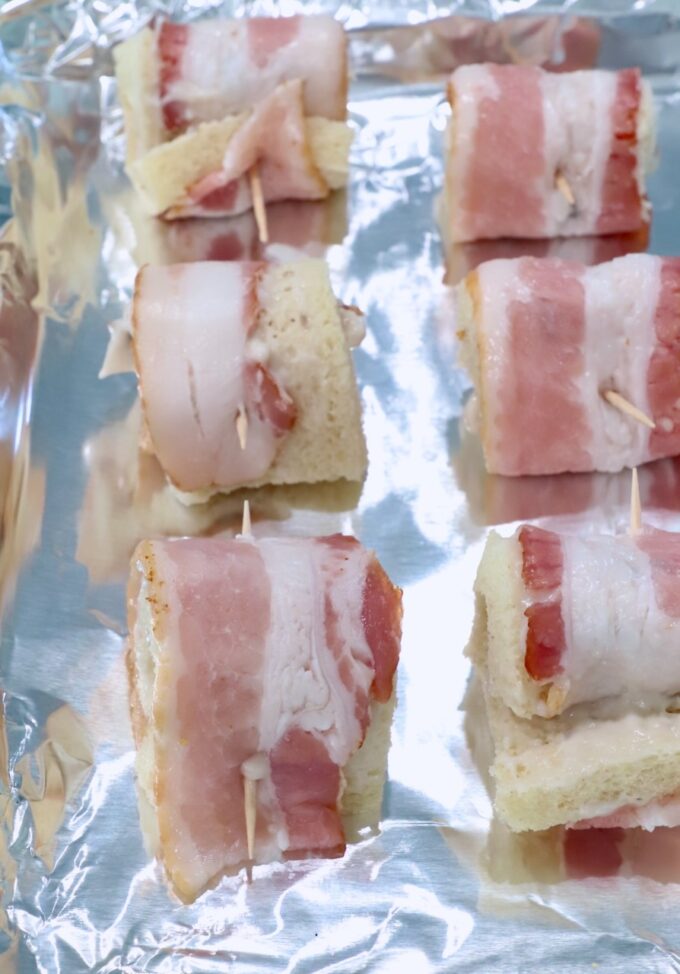 bacon roll ups on a foil lined baking sheet