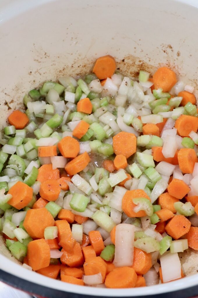 diced vegetables in a cast iron dutch oven