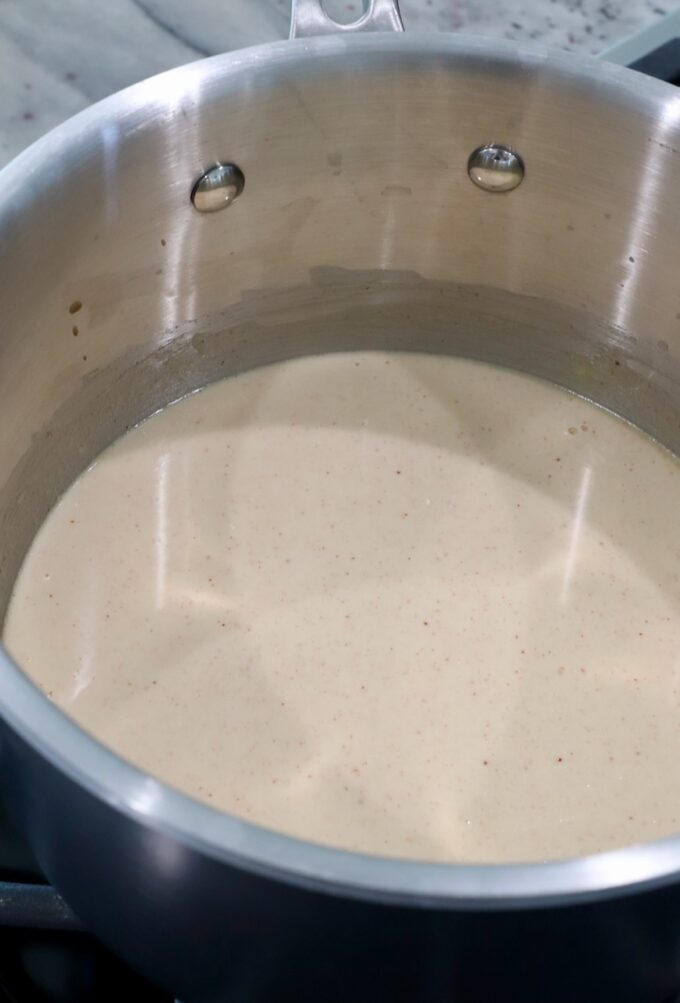 seasoned creamy sauce in a pot on the stove