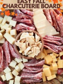 fall charcuterie board with meats cheeses and crackers