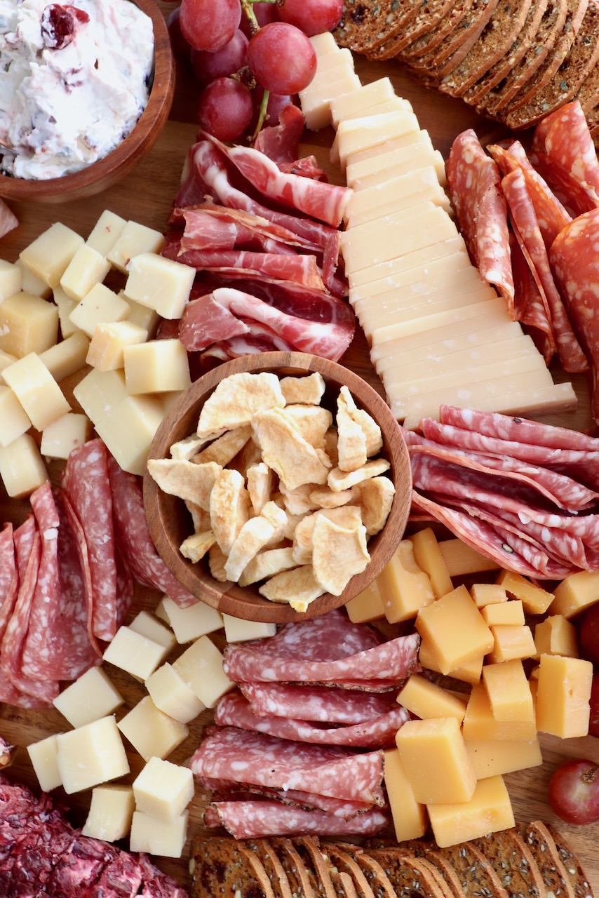 fall charcuterie board with meats cheeses and crackers