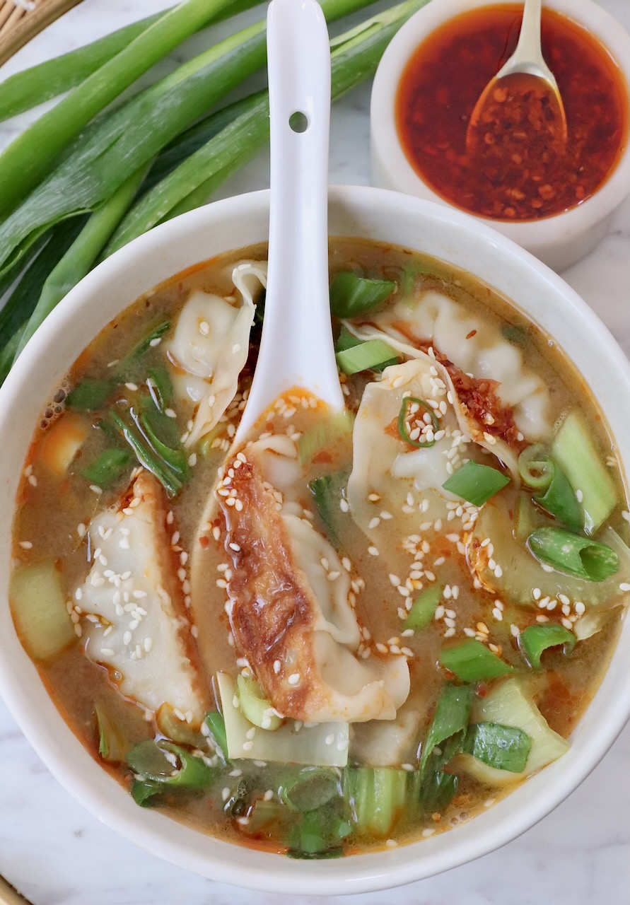 gyoza soup in bowl with spoon