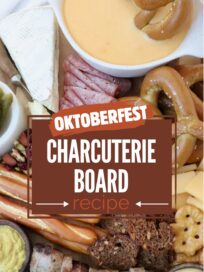 Oktoberfest charcuterie board with soft pretzel dipped in beer cheese dip