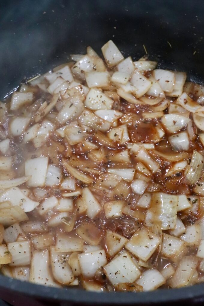 diced onions in beef broth in a dutch oven