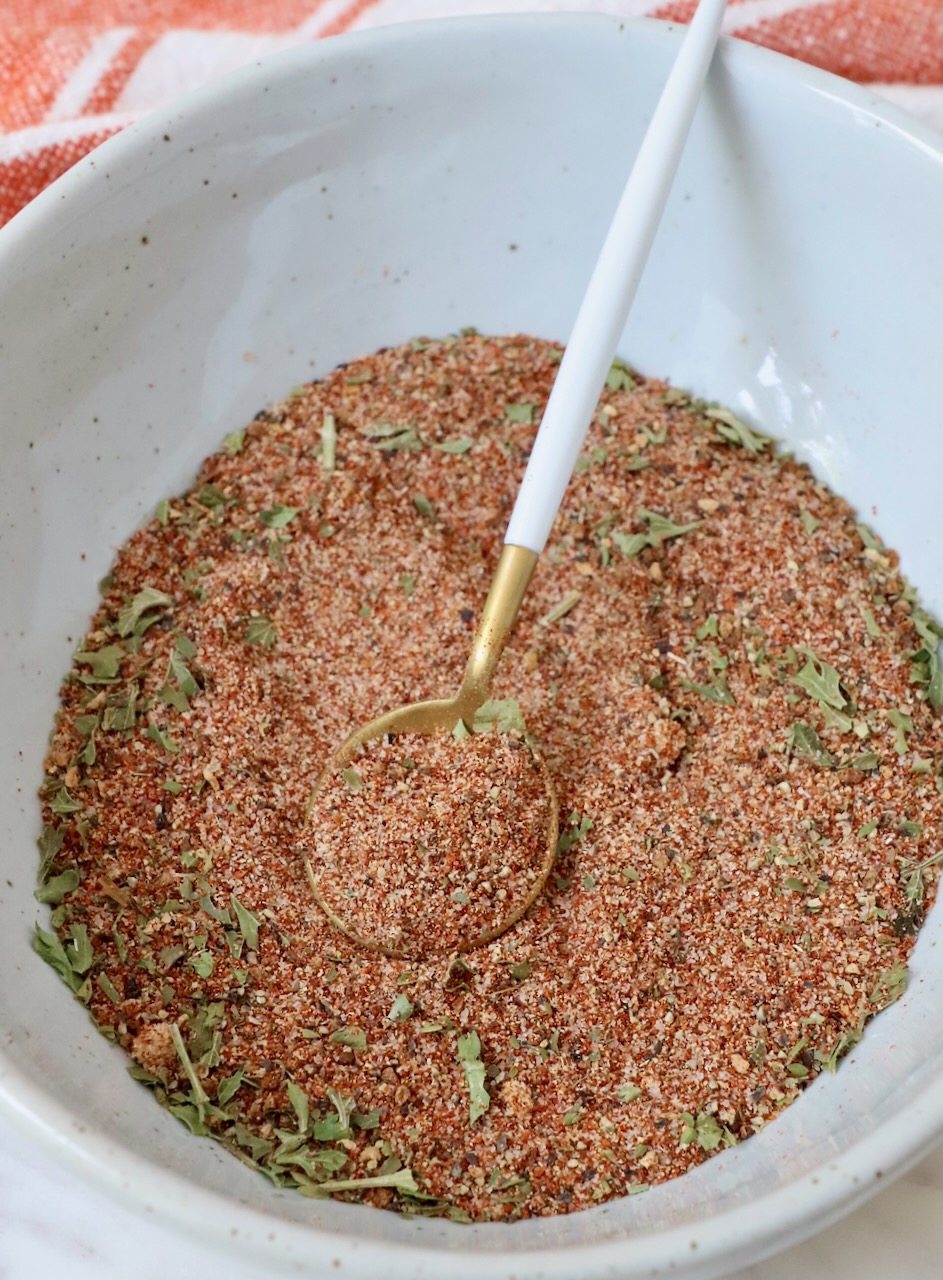 salmon seasoning mixed together in a bowl with a spoon