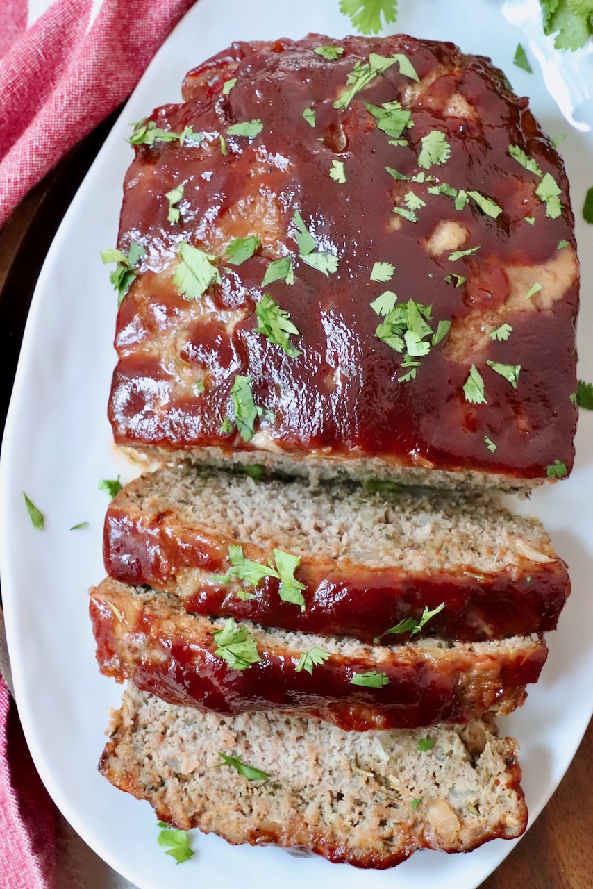 turkey meatloaf glazed with bbq sauce sliced on a plate