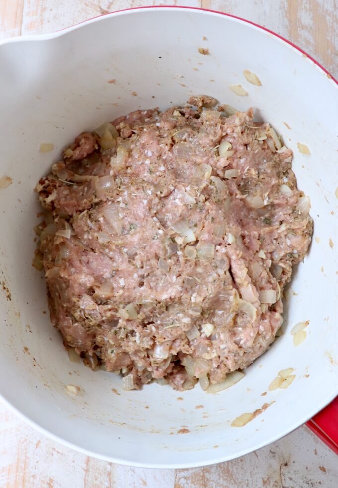 ingredients for turkey meatloaf mixed together in a large mixing bowl