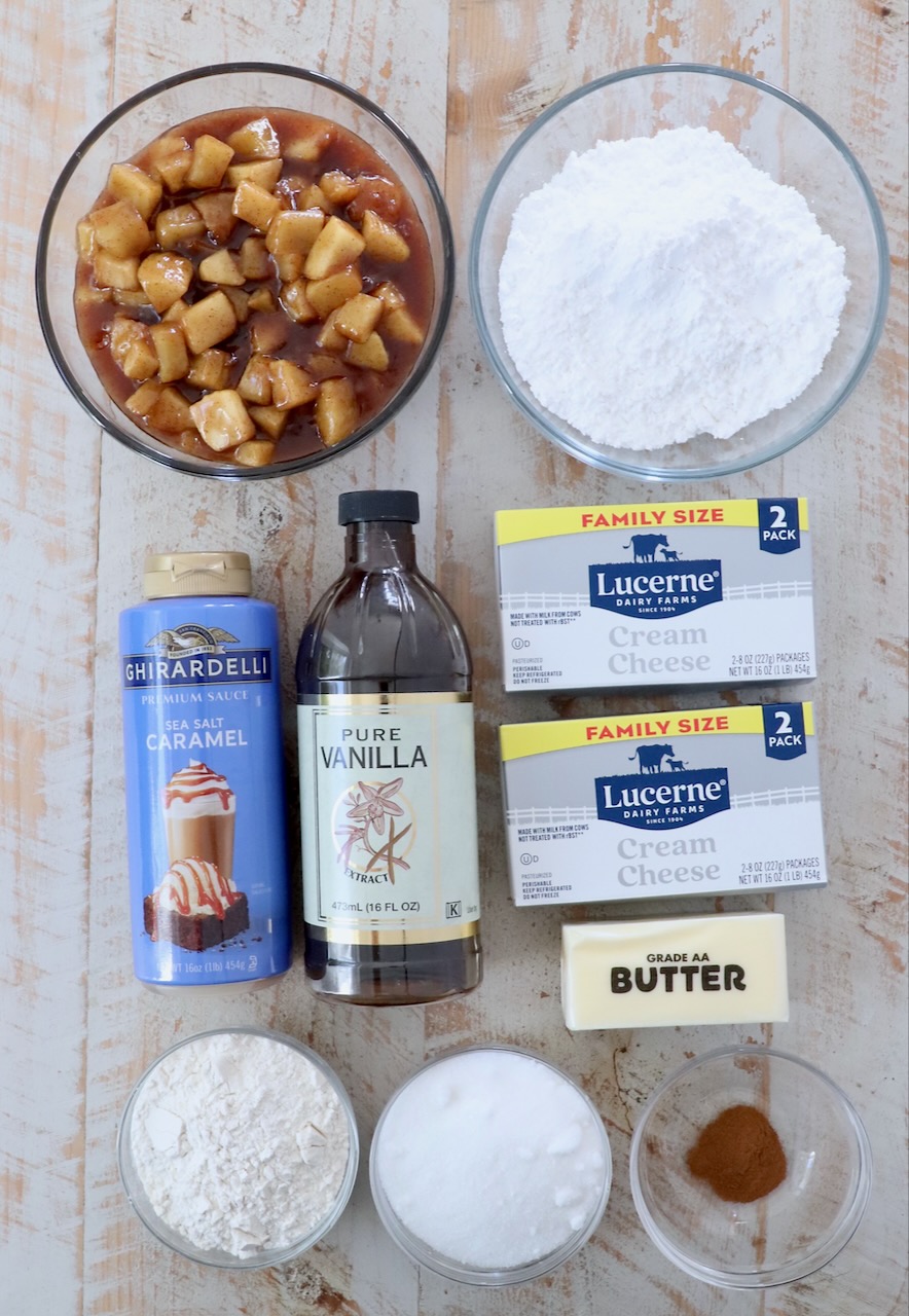 ingredients for apple pie dip on a white wood board