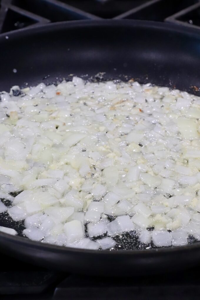 diced onions and garlic in a skillet