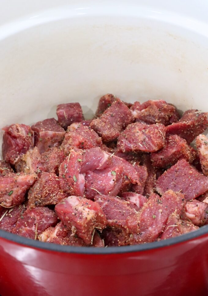 raw, seasoned, cubed beef in a large dutch oven