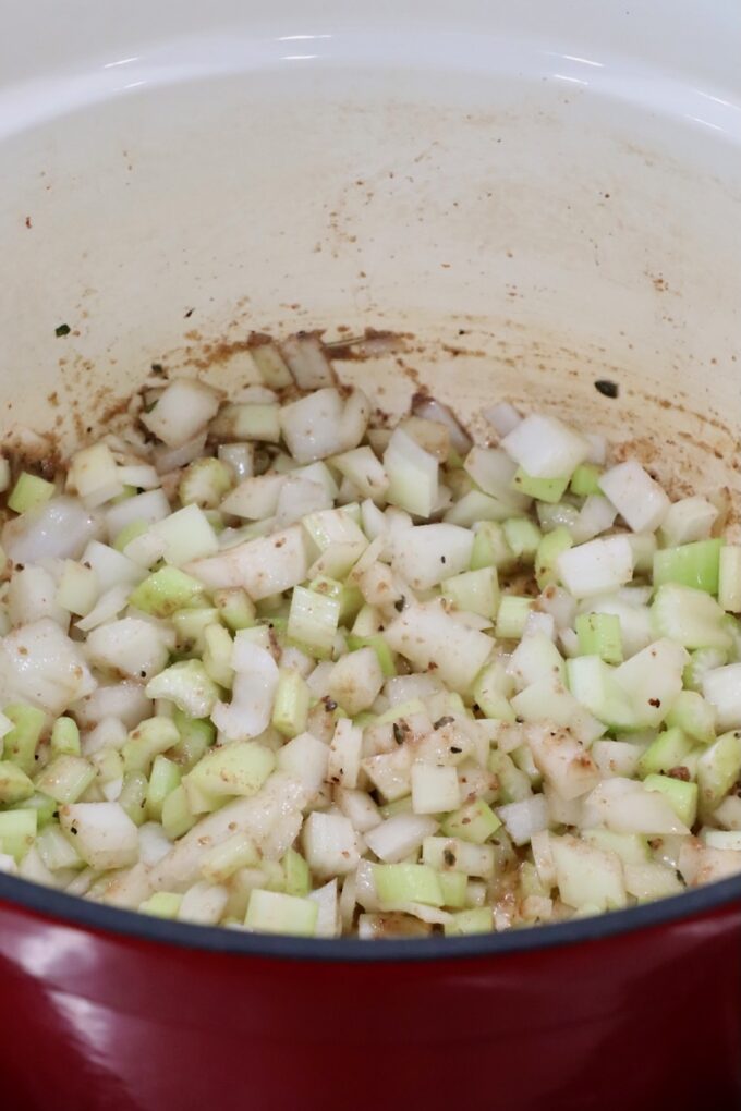 diced onions and celery in a dutch oven