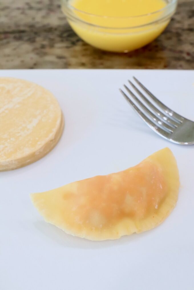 uncooked buffalo chicken bite on a cutting board