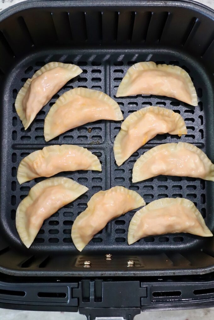 buffalo chicken bites in an air fryer basket