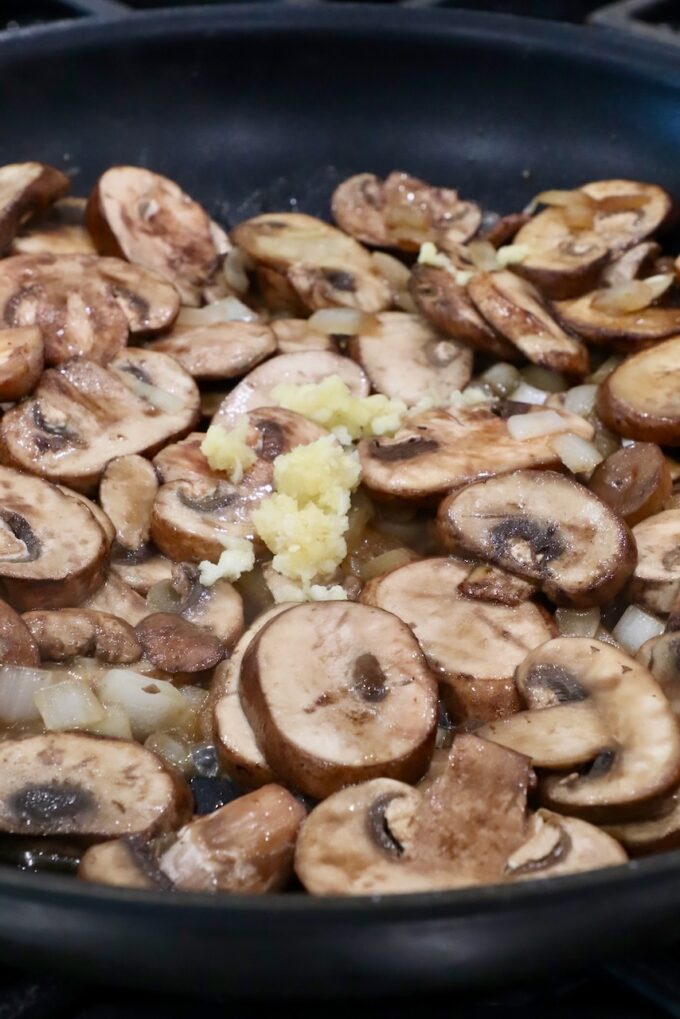 sliced mushrooms and minced garlic in a large skillet