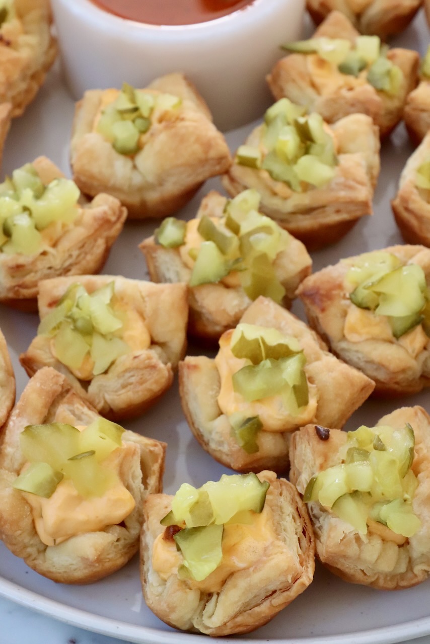 puff pastry pickles bites on a plate