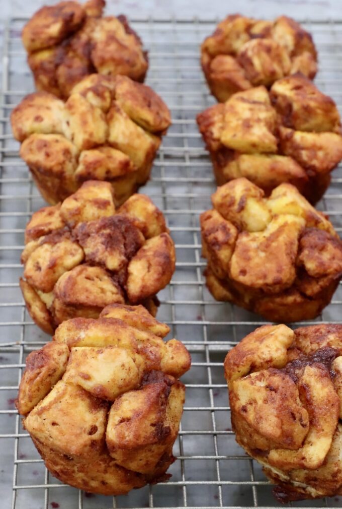 baked pull apart pumpkin cinnamon rolls on a wire rack