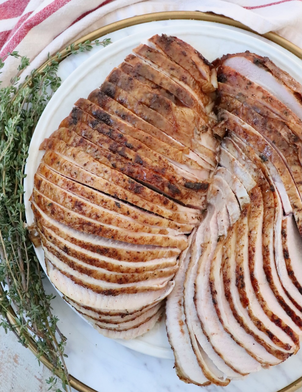 smoked turkey breasts sliced on a plate