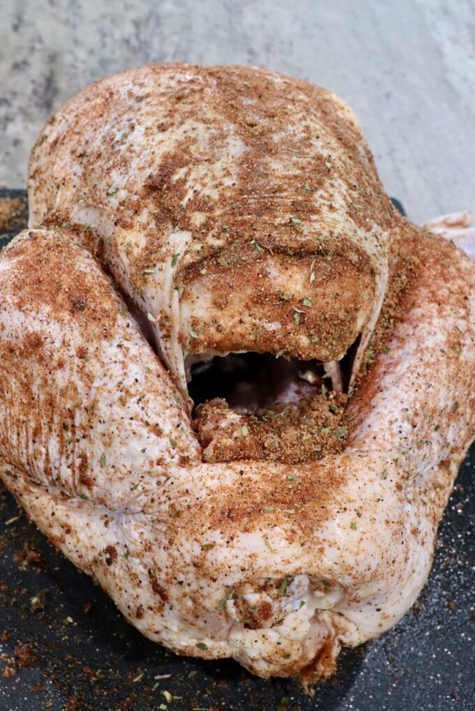 seasoned turkey on a cutting board