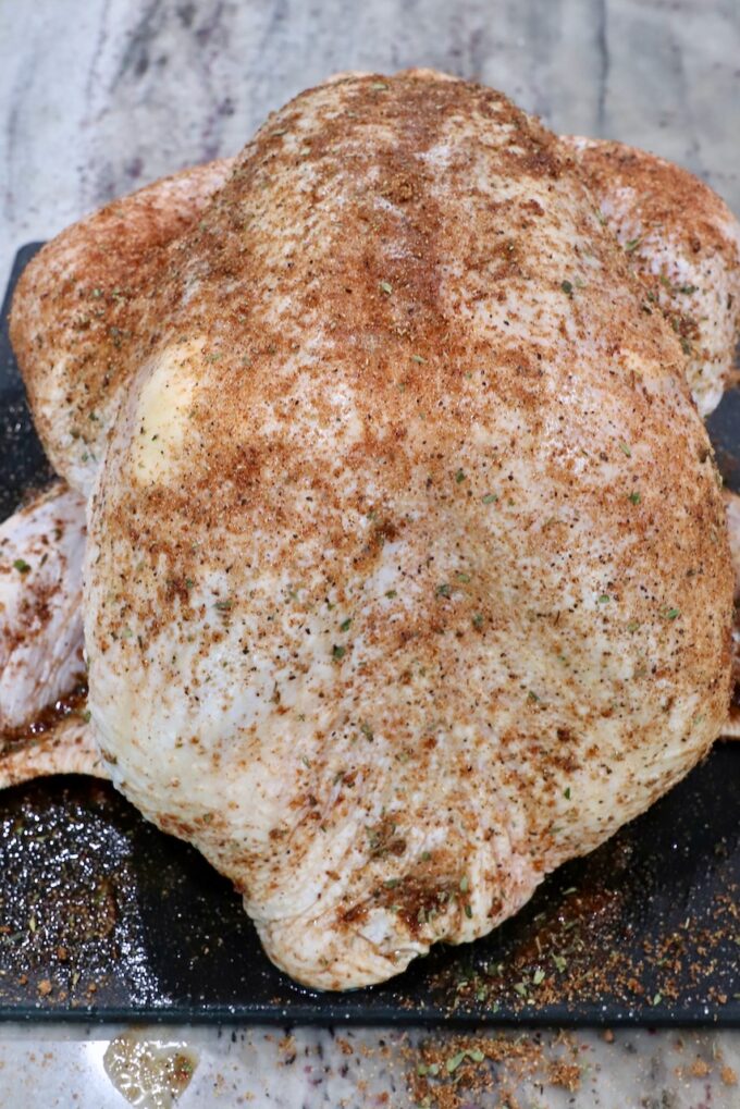 seasoned turkey on a cutting board