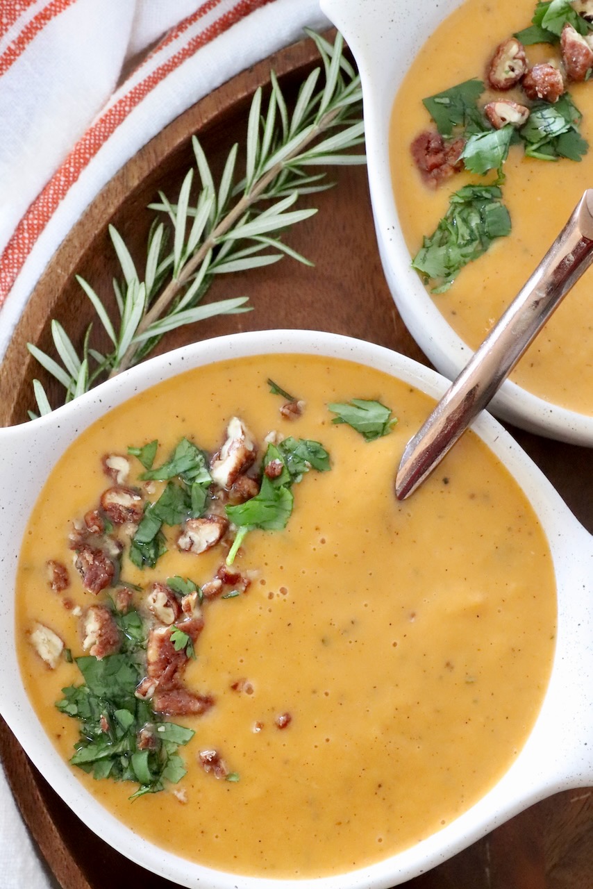 sweet potato soup in bowls with a spoon