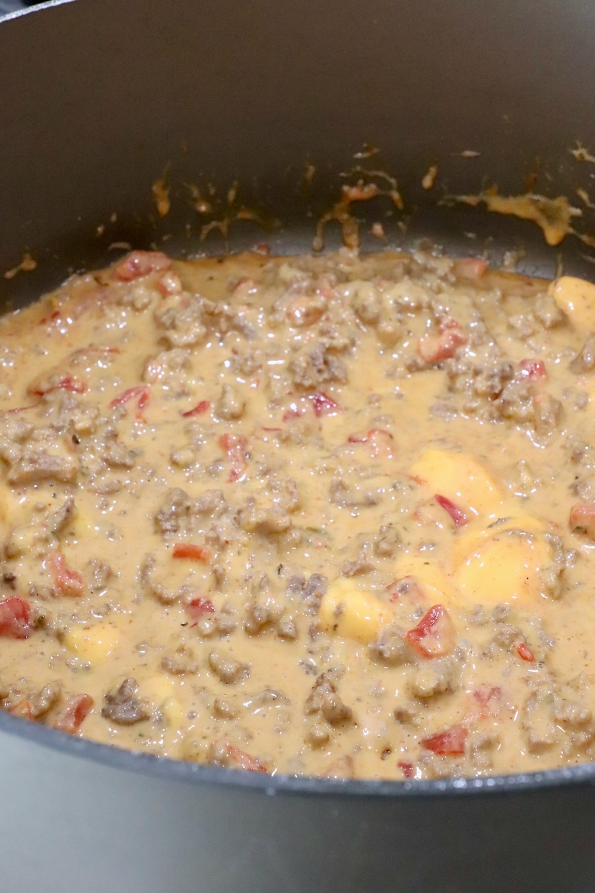 velvetta rotel dip in a large pot on the stove