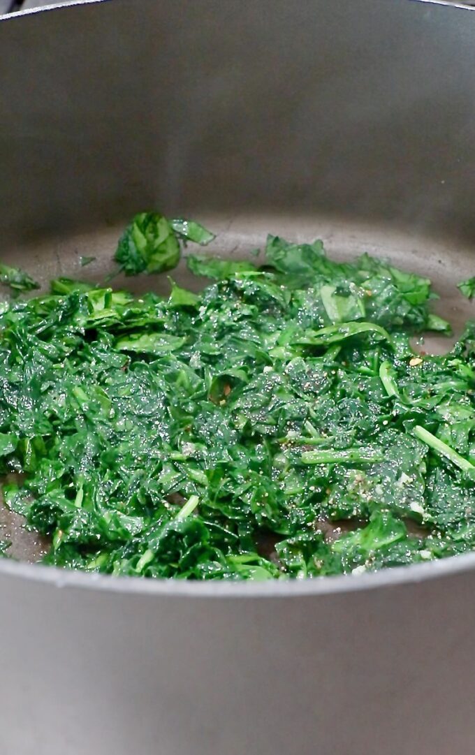 cooked spinach in a large pot