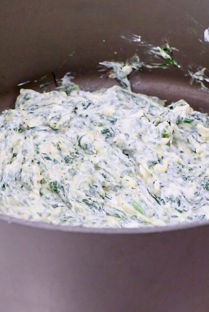 creamy spinach artichoke dip in a large pot