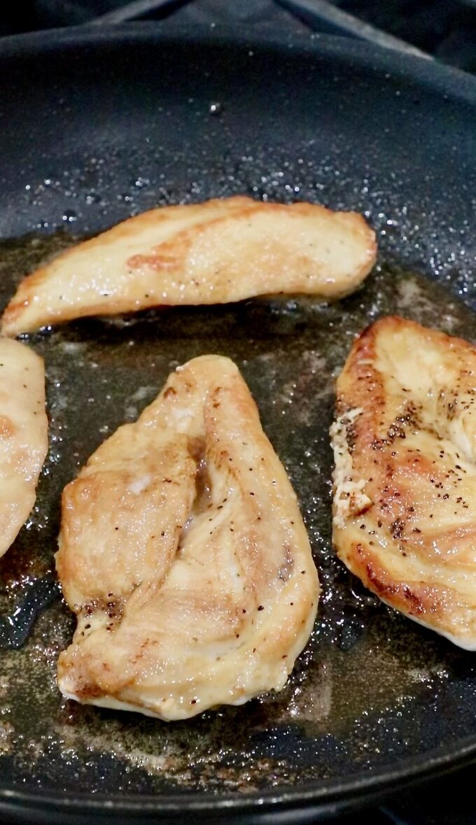 cooked chicken breasts in a skillet