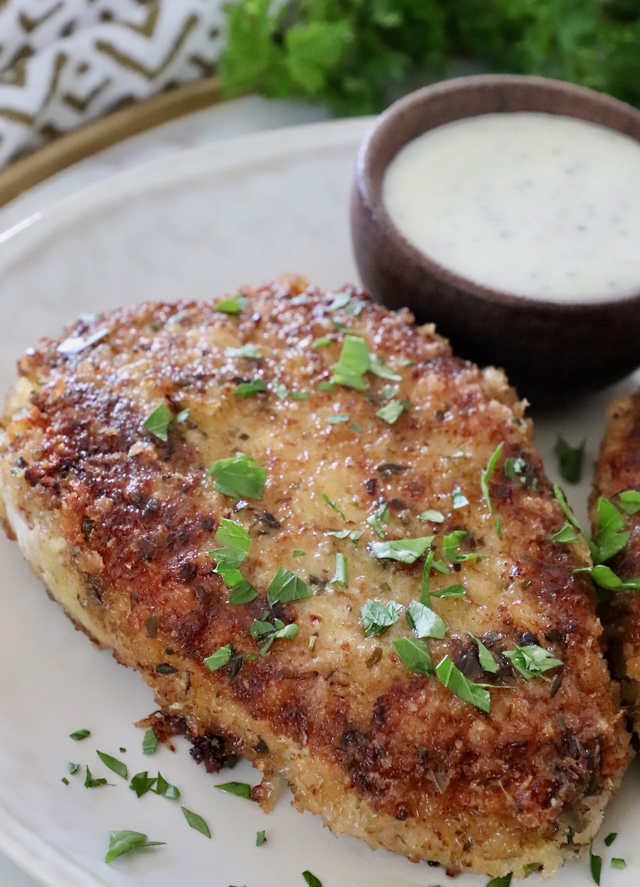 pan fried breaded pork chop on a plate