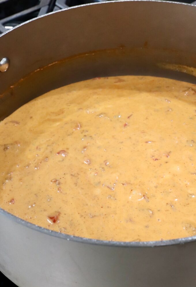 chili cheese dip in a large pot on the stove