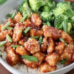 gochujang chicken in a bowl with rice and broccoli