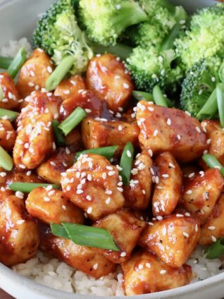 gochujang chicken in a bowl with rice and broccoli