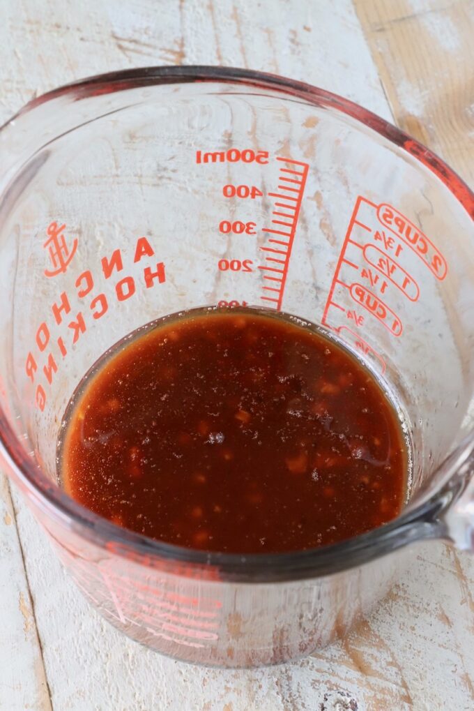 gochujang sauce in a glass measuring cup