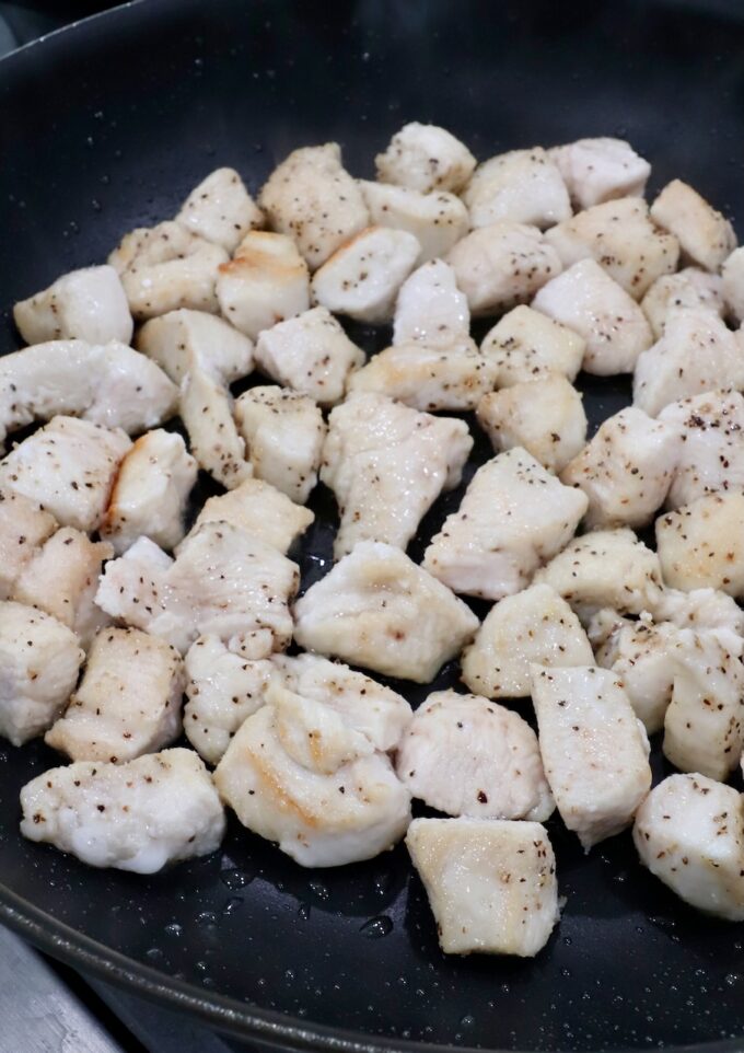 cooked pieces of chicken in a skillet