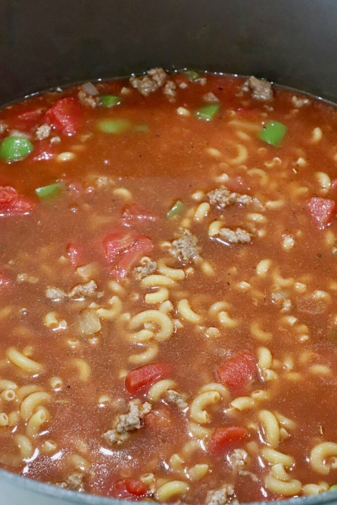 noodles, ground beef, and vegetables, in beef broth and tomato sauce in a large pot