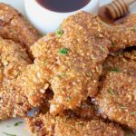 air fried chicken tenders piled up on a plate