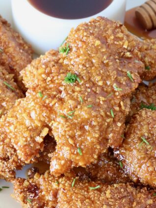 air fried chicken tenders piled up on a plate